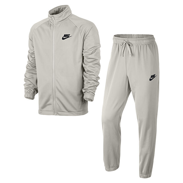 Nike essential tracksuit deals